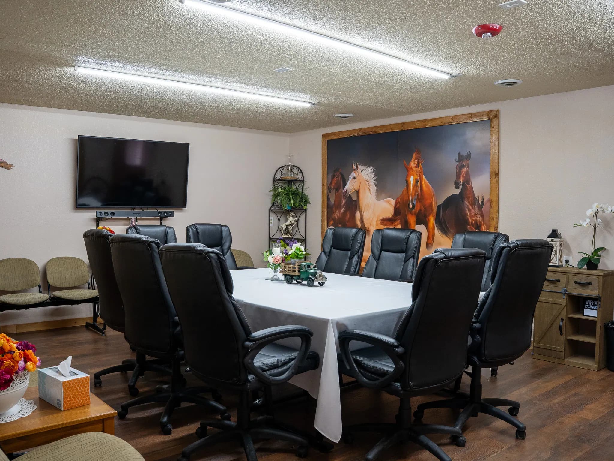 Boardroom meeting room with a round conference table at El Rancho Event Center