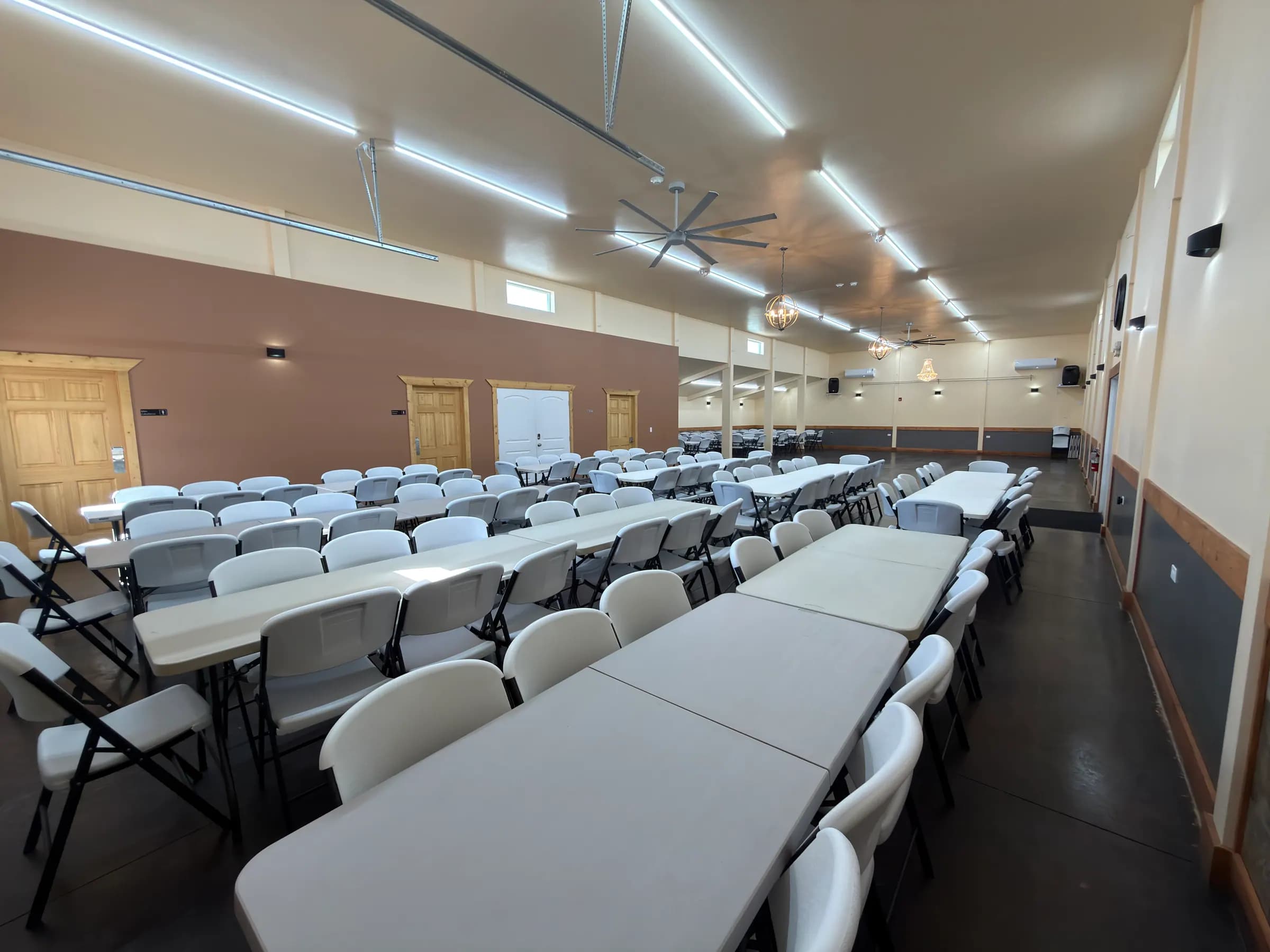 Grand Ballroom arranged with rows of tables and chairs beneath a vaulted ceiling
