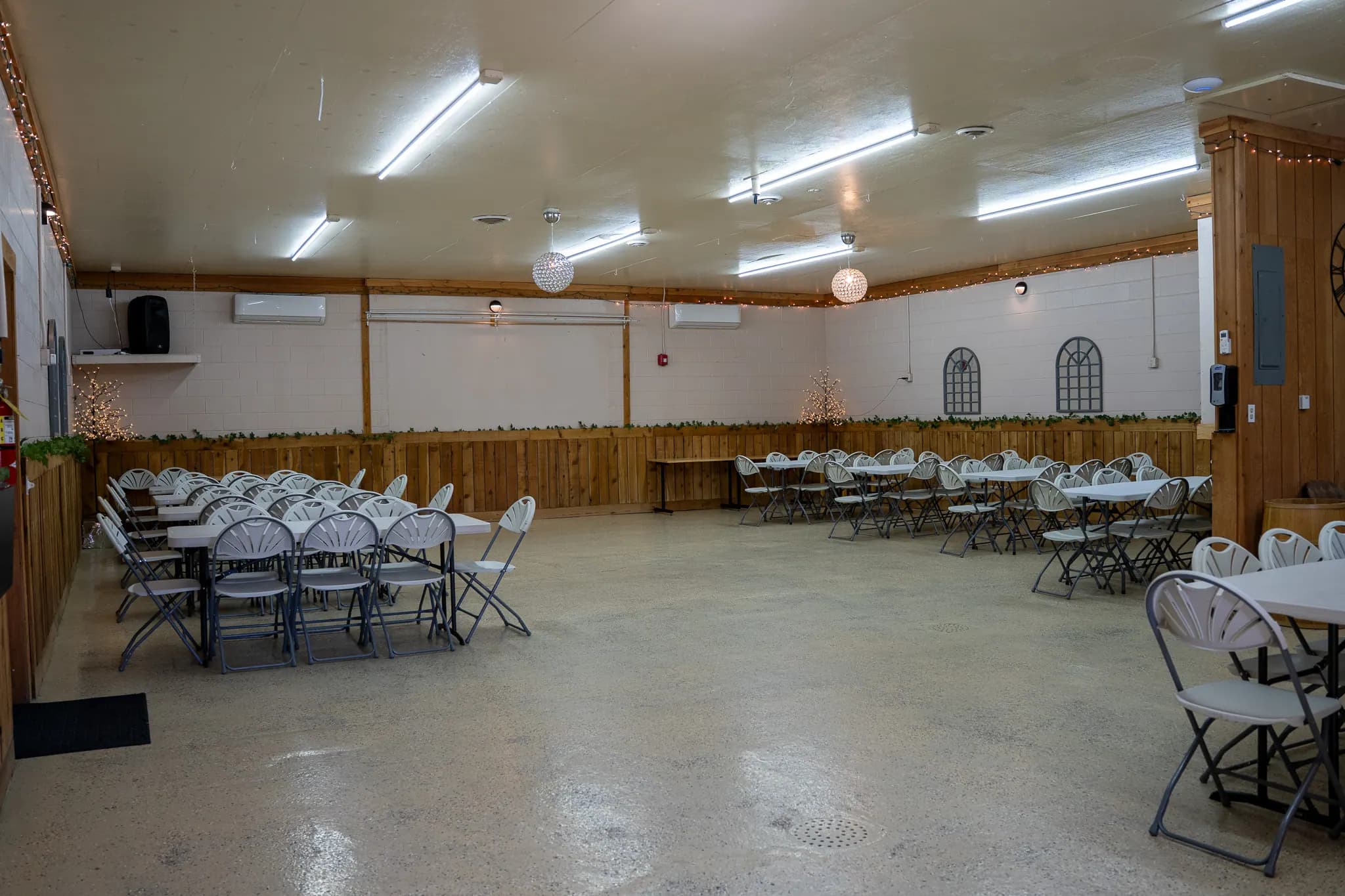 Mid-Size Hall set for a seated dinner with rustic wood accents